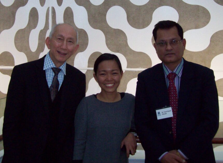 Dr. Tarit Kanti Ghosh standing with two colleagues in a professional setting.