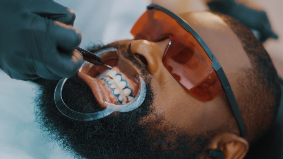 a man getting Cosmetic Dentistry by a dentist