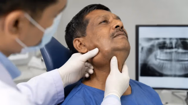 Medical examination of jaw cancer and oral tumours with face and neck assessment