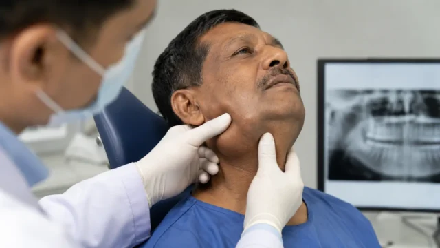 Medical examination of jaw cancer and oral tumours with face and neck assessment