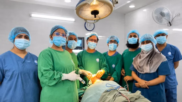 Multidisciplinary oral cancer surgical team in a Dhaka hospital operating room
